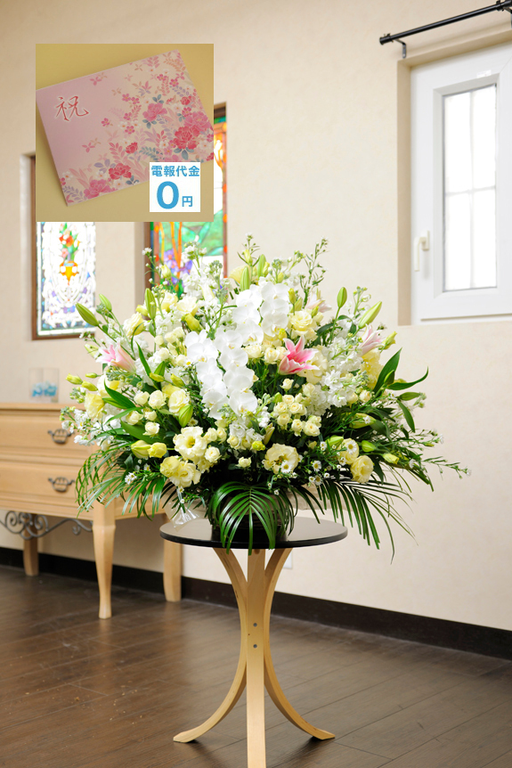 大型サイズのアレンジメントフラワーＬサイズを白いお花を中心にお仕立て致します。幅広い用途に、お祝い事にご利用頂ける白いお花は清潔感、清楚な雰囲気を前面に押し出したお祝い花となっております。